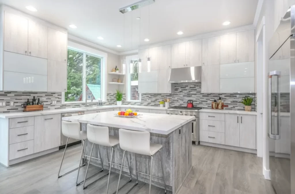 Bright kitchen with modern home staging and island seating.
