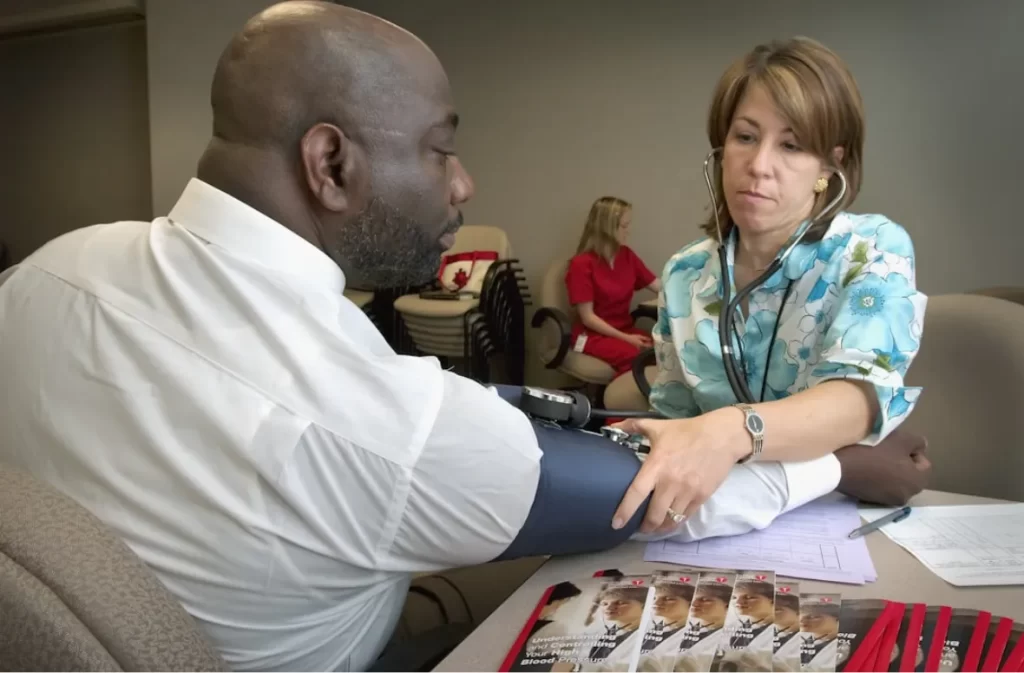 Doctor monitoring blood pressure for relaxation.